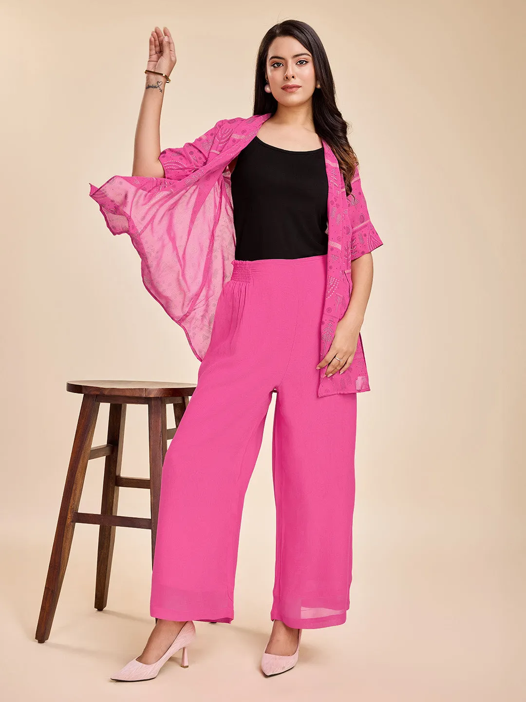 elegant printed short sleeve shrug, a plain comfortable flared pants with smocking at back & a plain black bustier  set in Georgette - Pink
