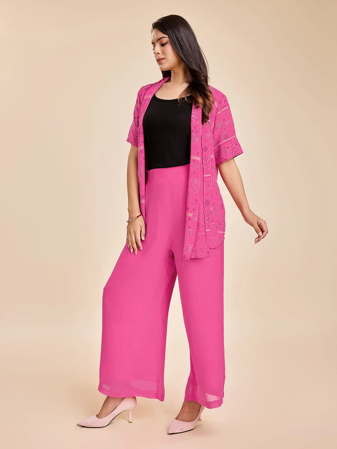elegant printed short sleeve shrug, a plain comfortable flared pants with smocking at back & a plain black bustier  set in Georgette - Pink