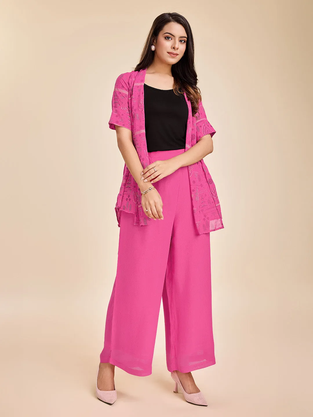 elegant printed short sleeve shrug, a plain comfortable flared pants with smocking at back & a plain black bustier  set in Georgette - Pink