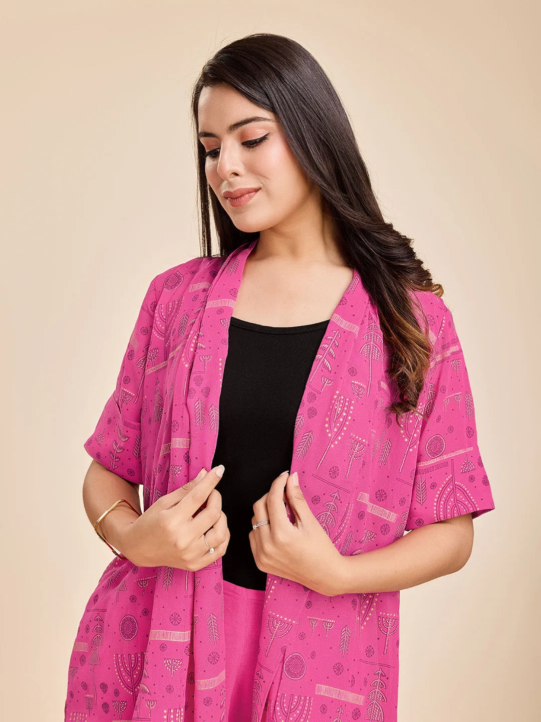 elegant printed short sleeve shrug, a plain comfortable flared pants with smocking at back & a plain black bustier  set in Georgette - Pink